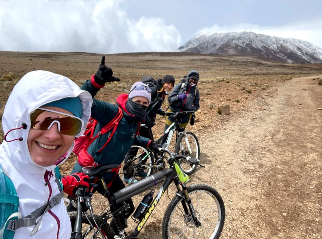 Cyclists with Kilimanjaro in backdrop