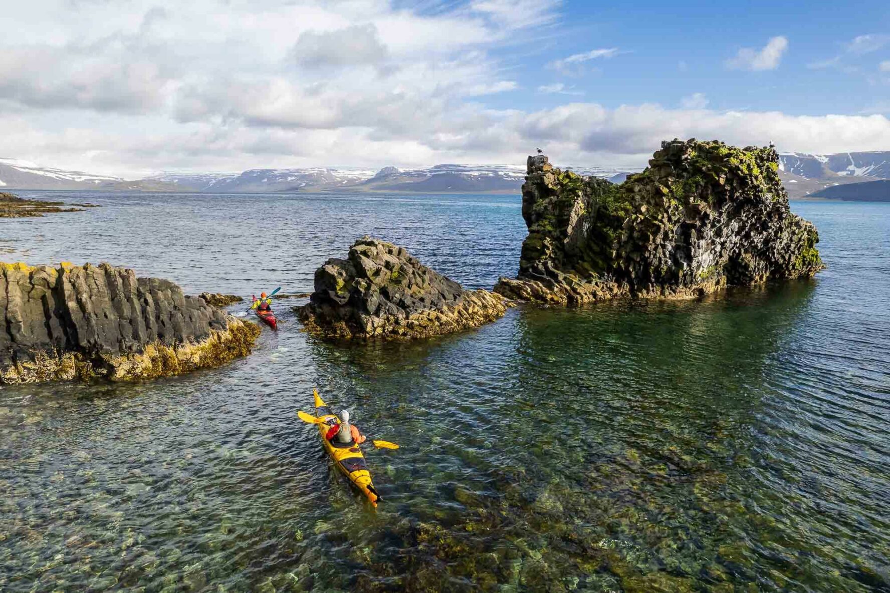 Kayak crossing between rocks in Iceland