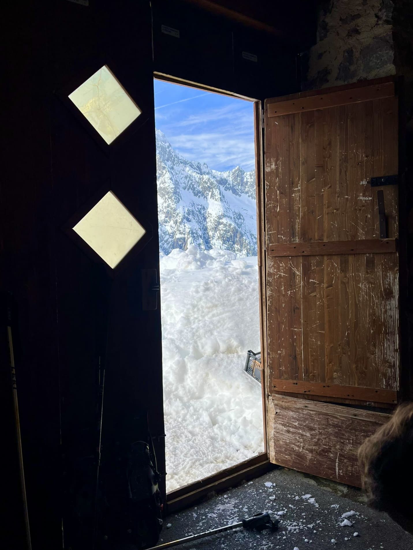 Look out the door of a mountain hut