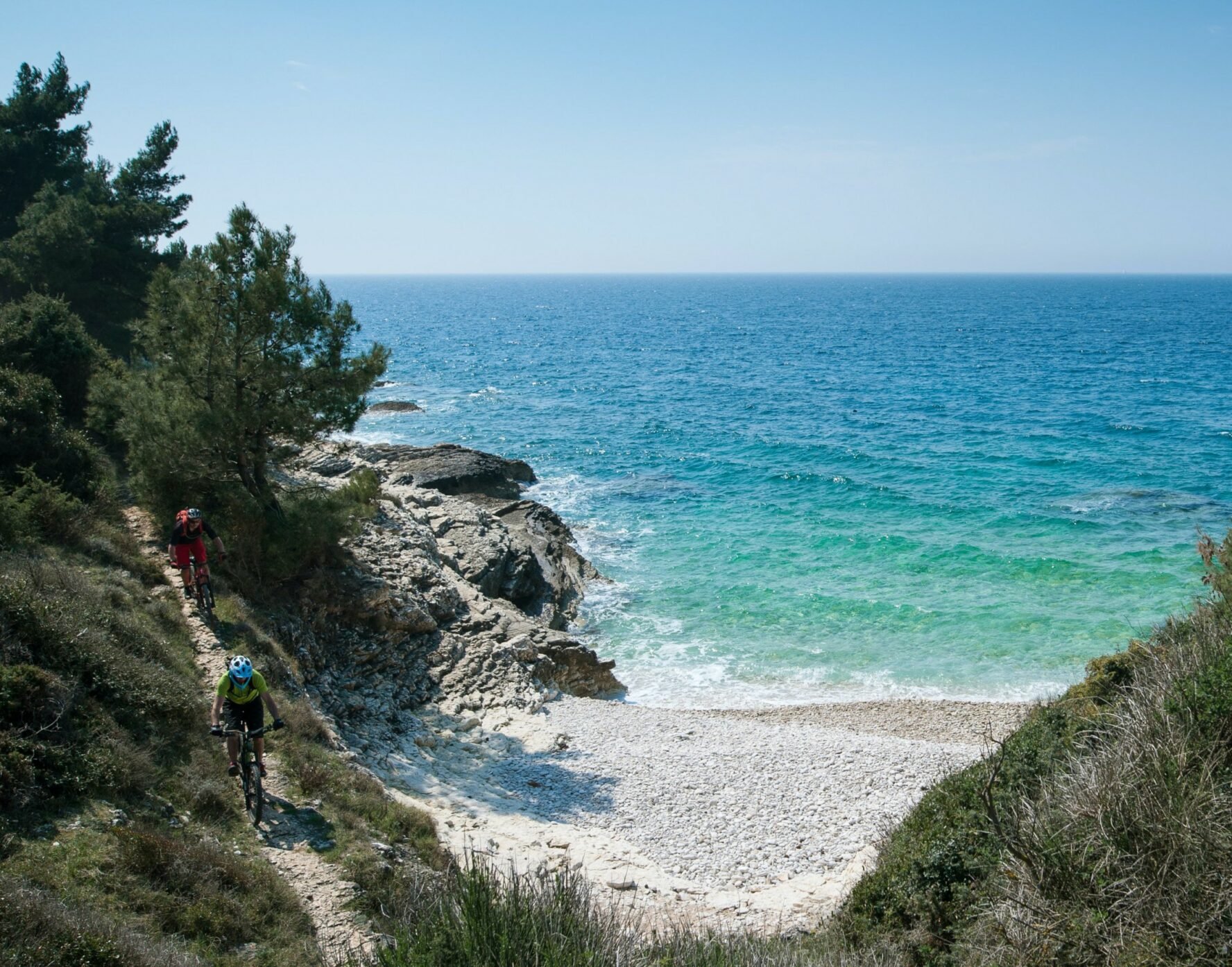 Mountain bikers riding by the coast in Istria, Croatia.