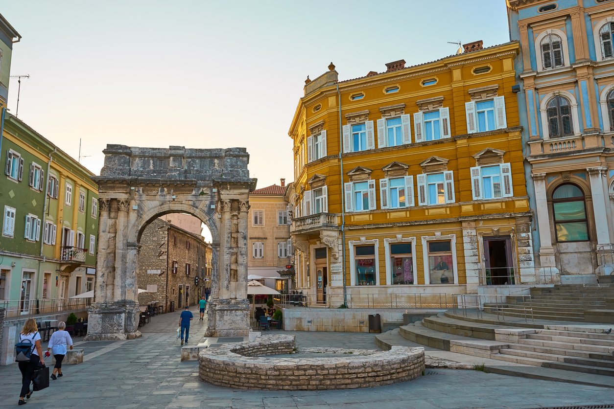The historic center of Pula with a Roman arch.