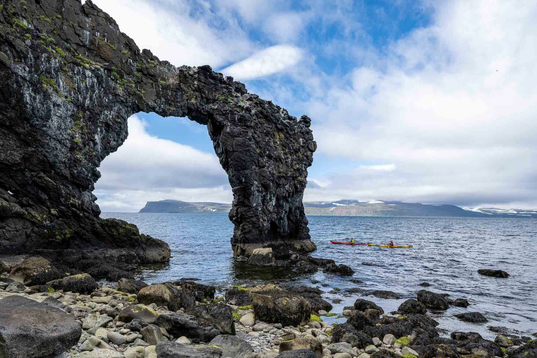 Rock arch in Iceland and kayaks