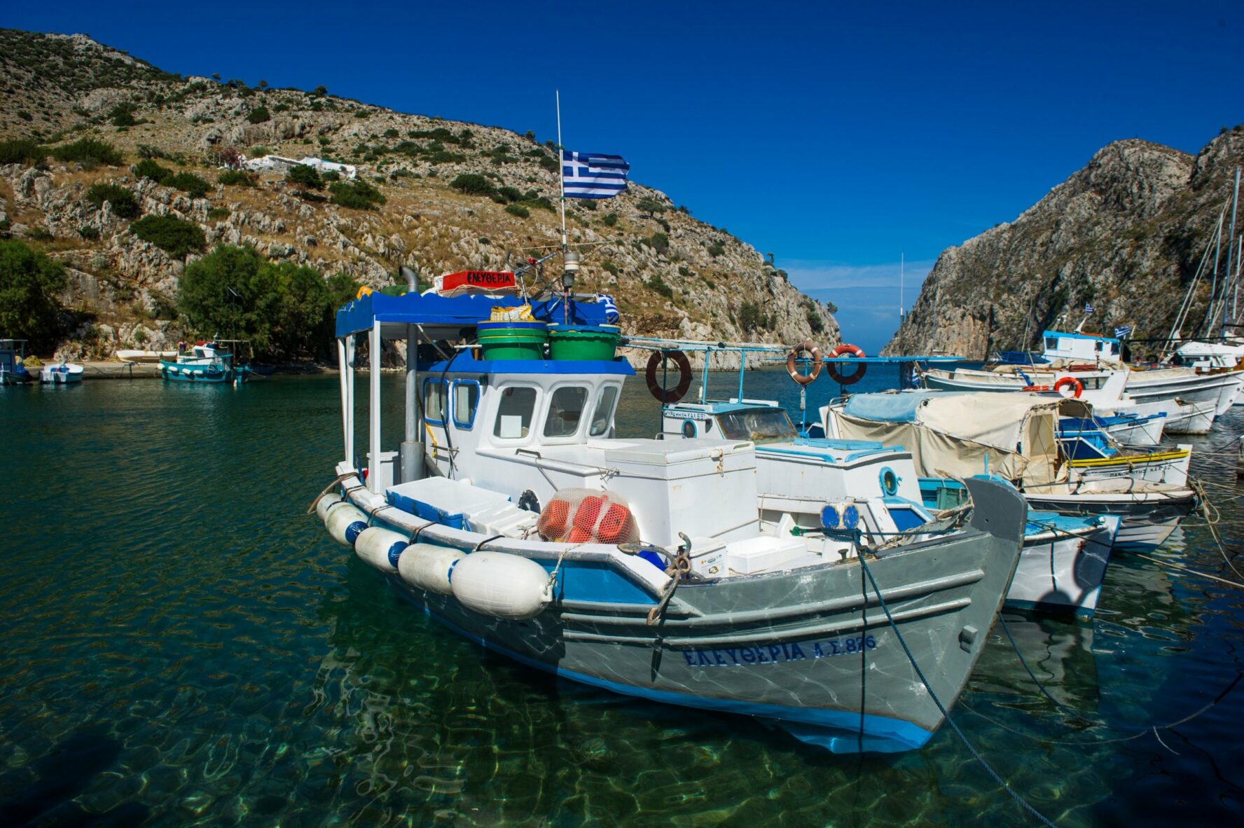A secluded bay in the South Greek Aegean with fishing boats.