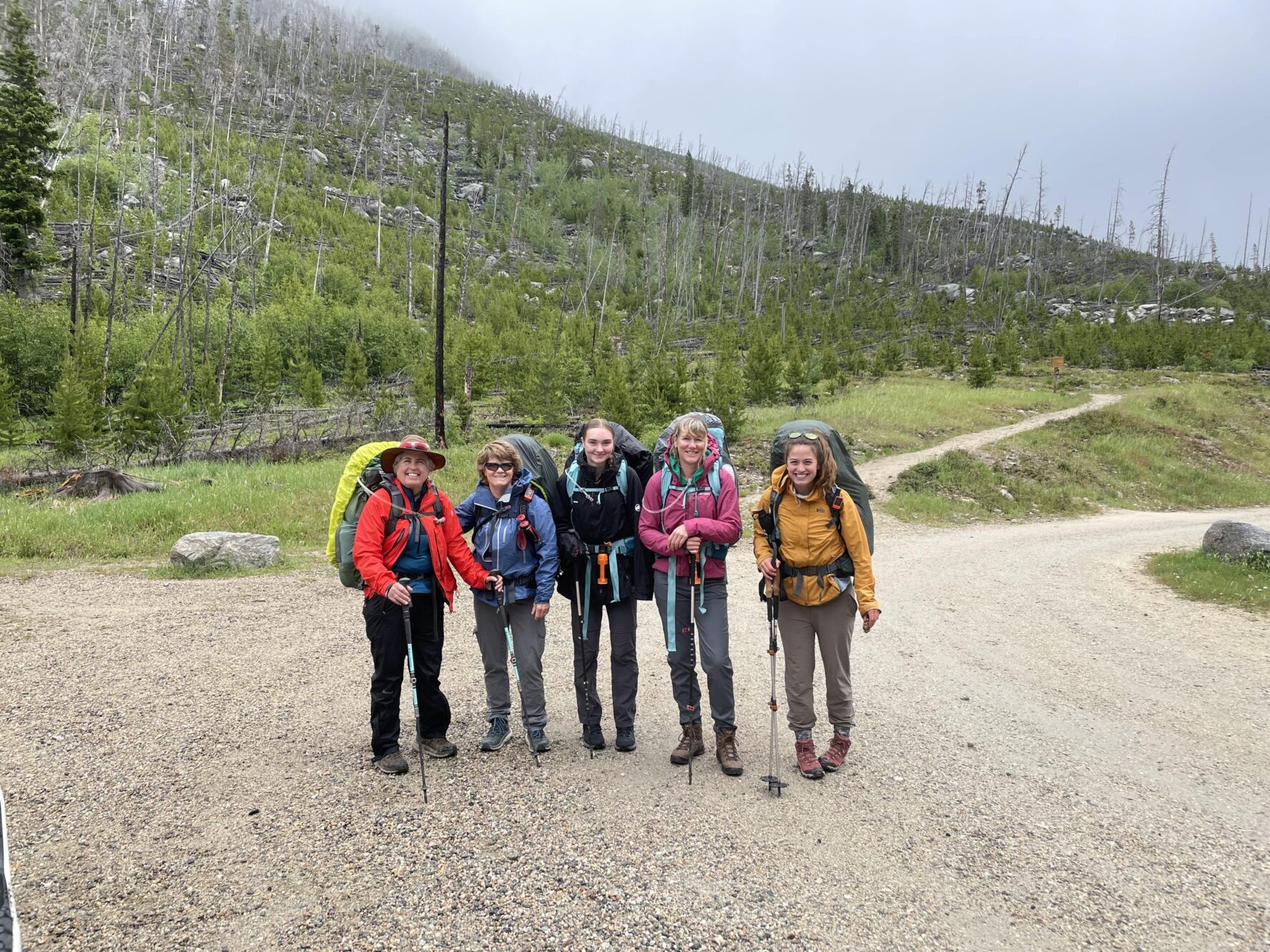 Hikers posing in the Beartooth Mountains