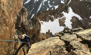 Granite Peak climber is rappelling