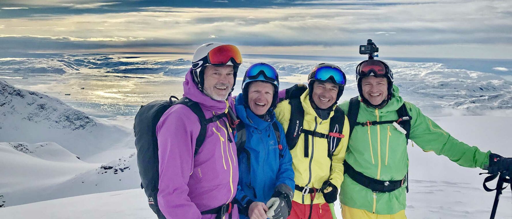Happy group skiing in Greenland