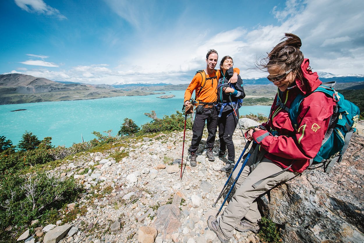 Hikers near a lake in Torres