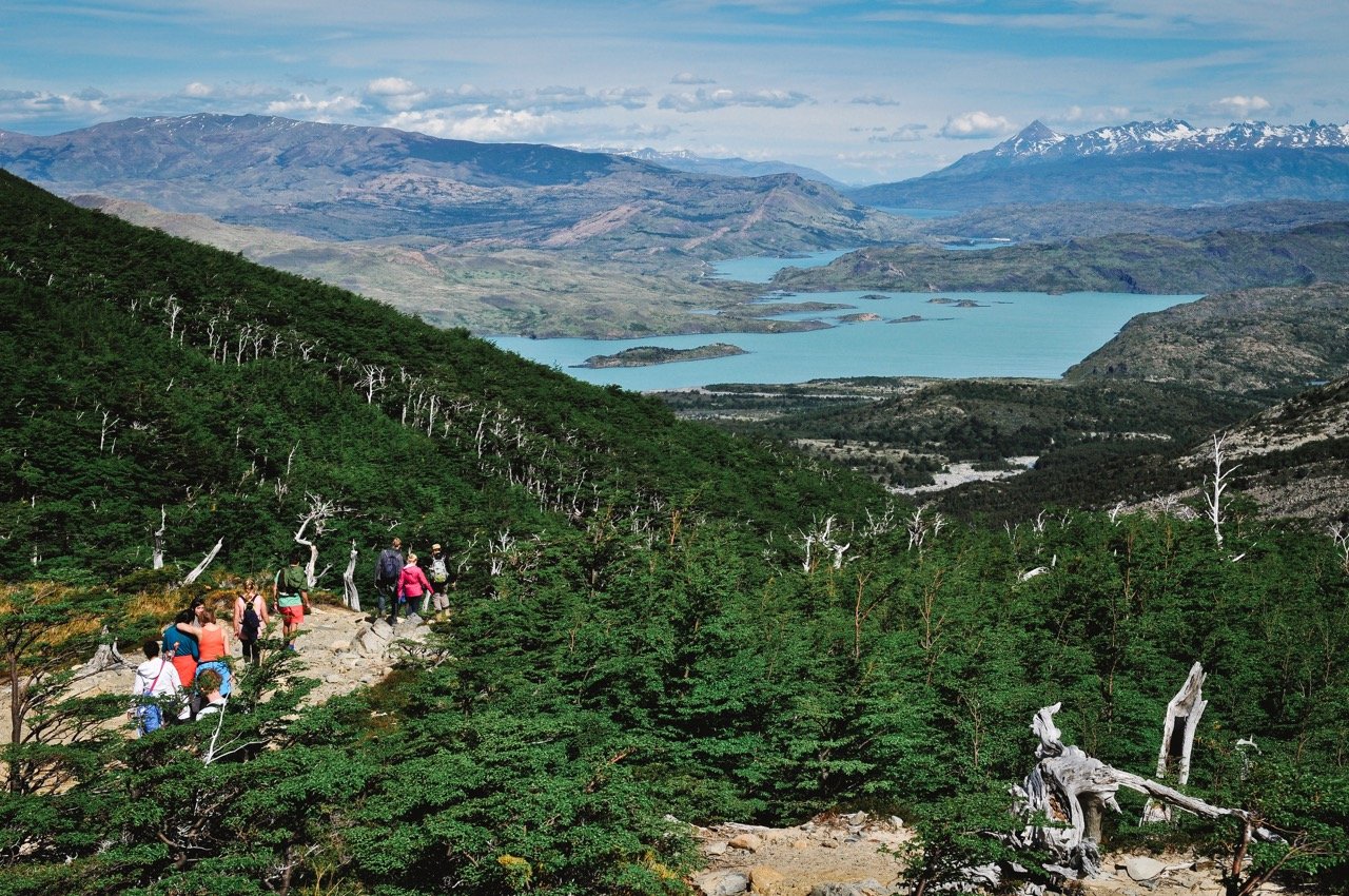 Hikers in Torres del Paine and lake