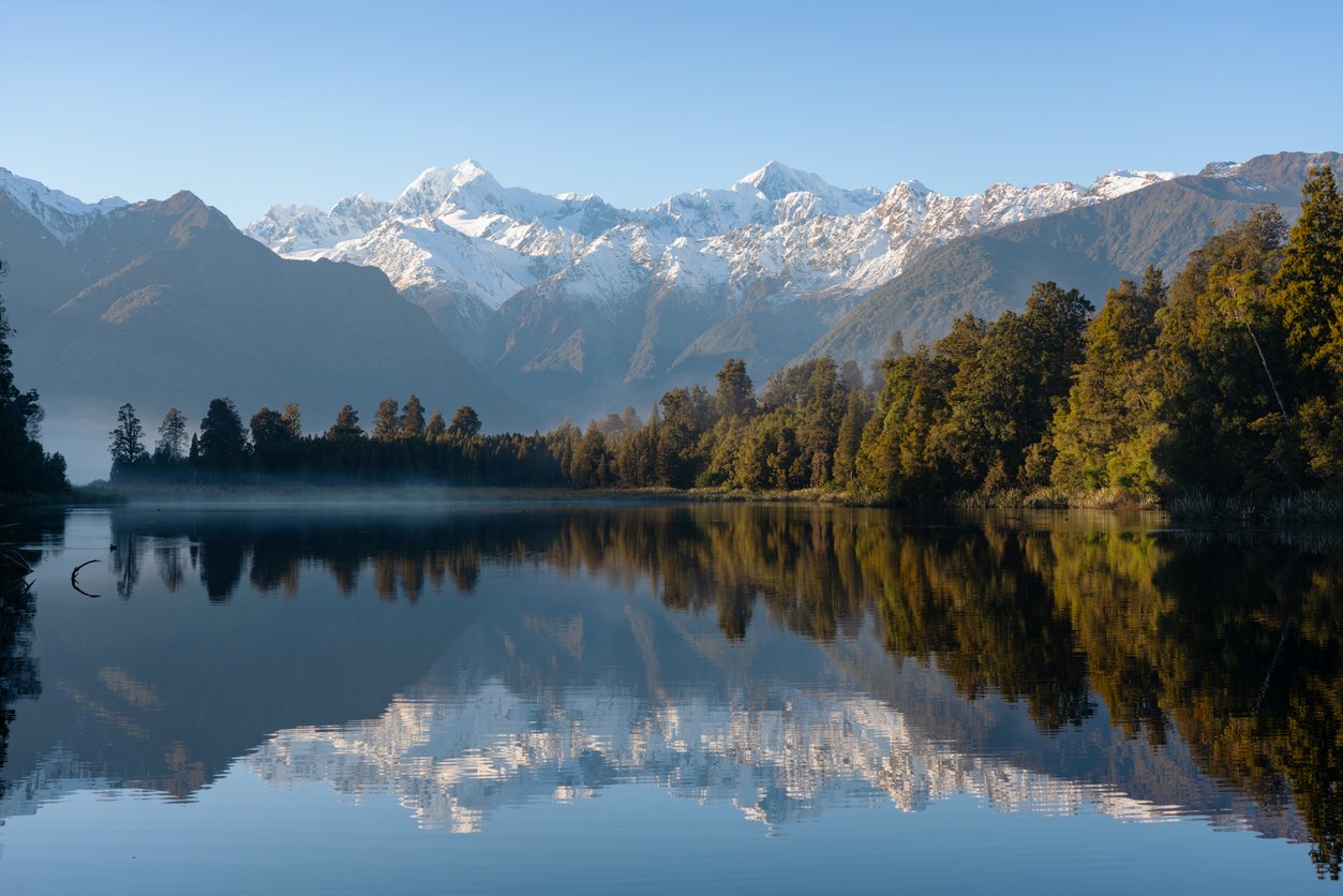 Lake Matheson with the snow-capped peaks of the Southern Alps in New Zealand’s South Island.