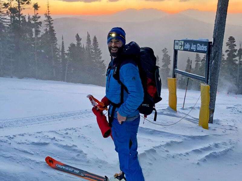 A backcountry skier in Colorado’s Rockies during sunset.