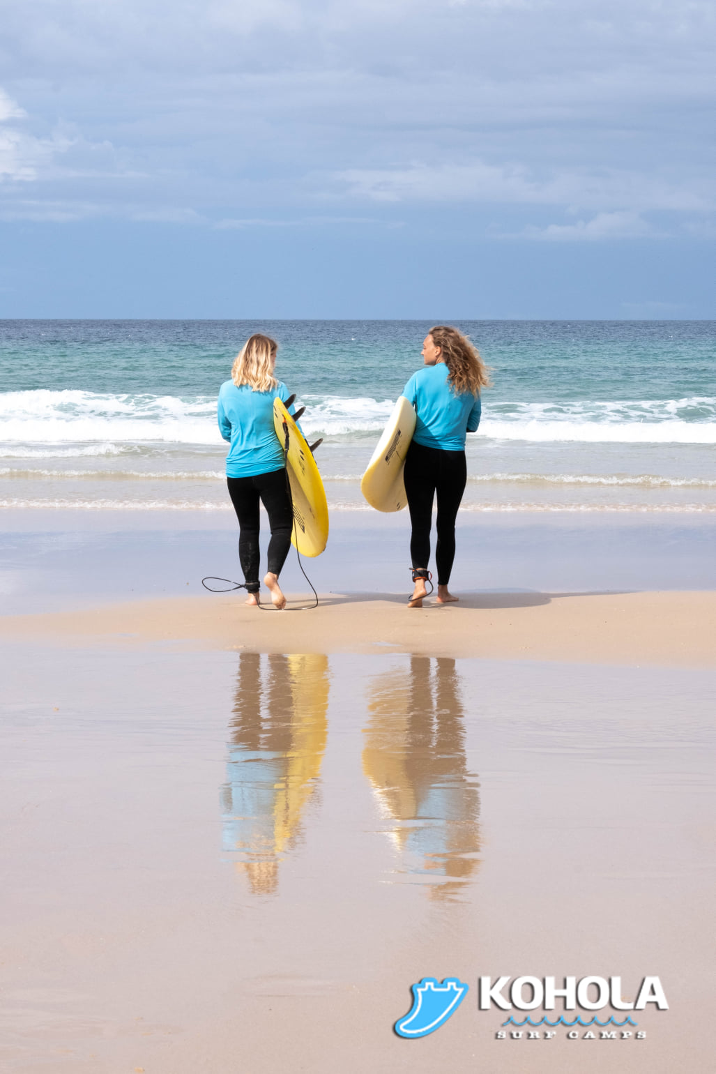 Two surfers on the beach