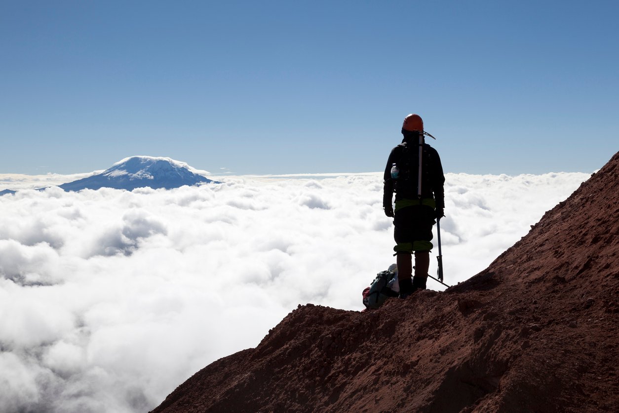 A mountaineer standing near the summit of Cotopaxi.
