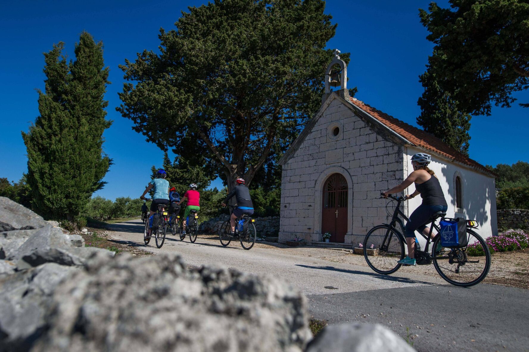 Cycling next to a chapel