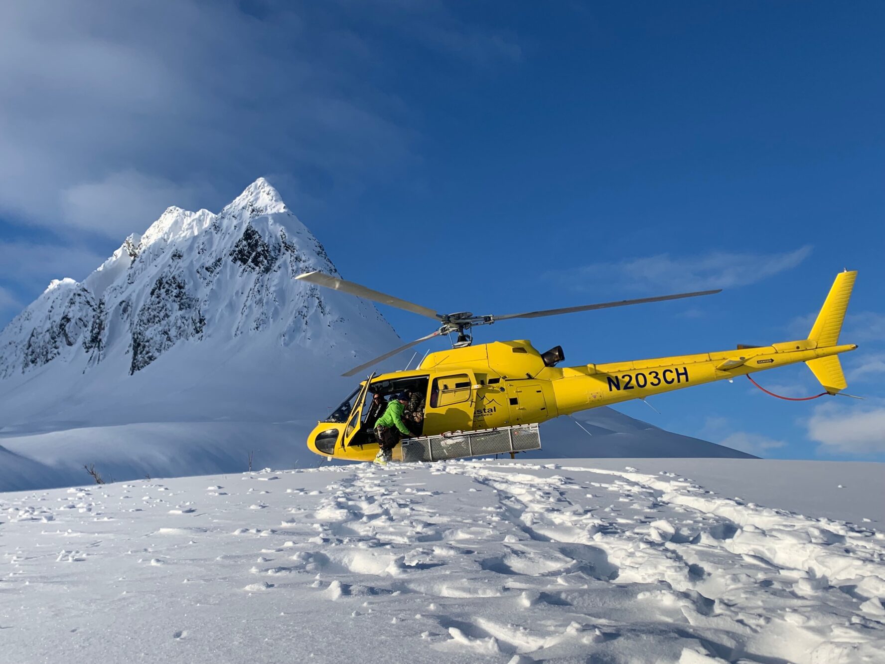 Helicopter carrying skiers in Alaska