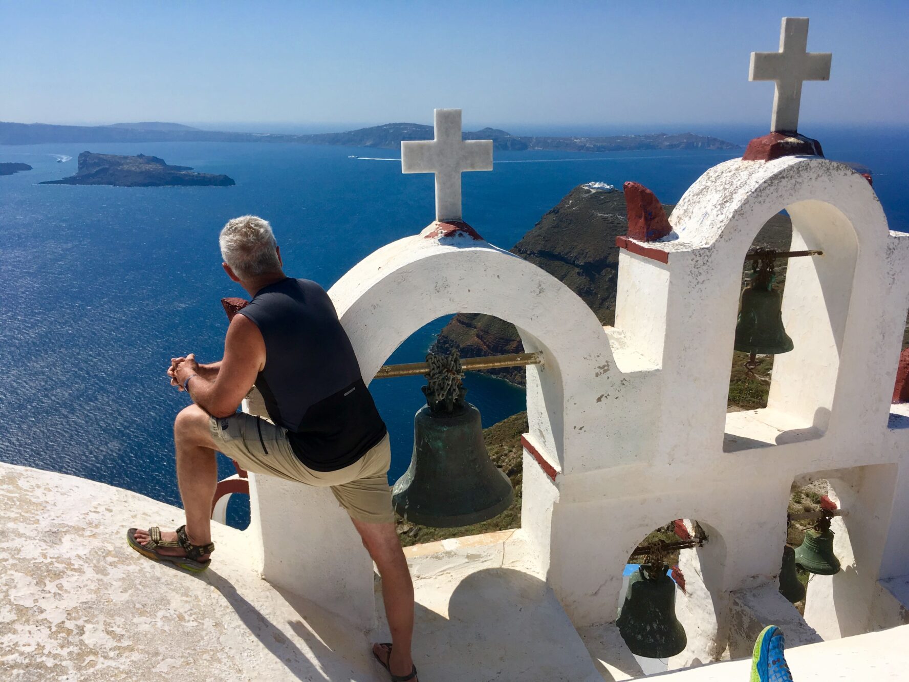 Hiker and view from Santorini