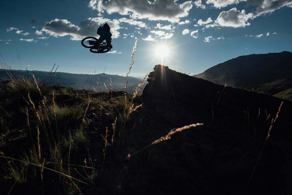 A biker doing a stunt on a jump line