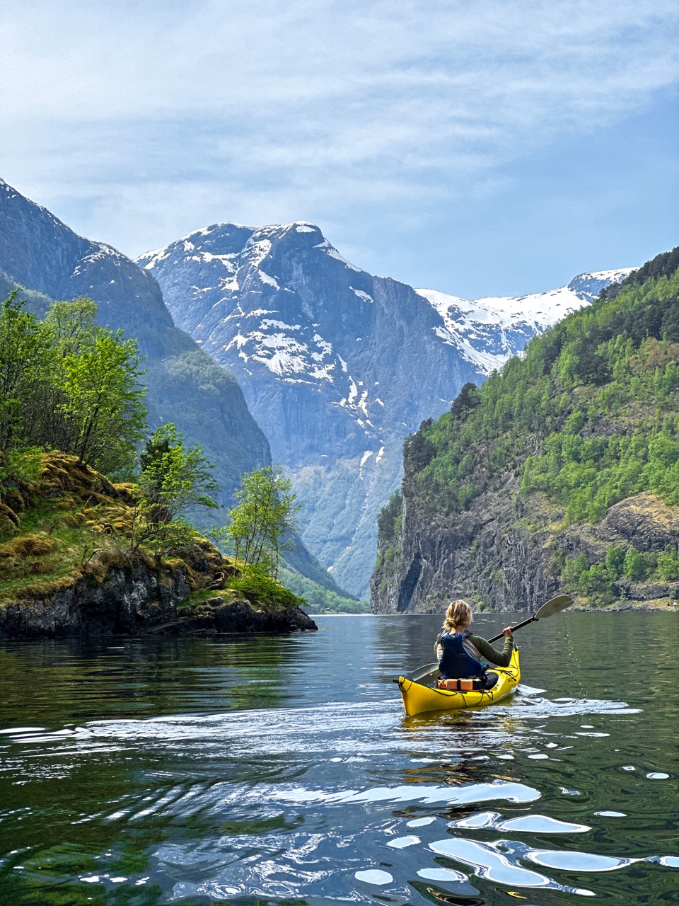 A kayaker enjoying the peace and quiet of Norwegian fjords