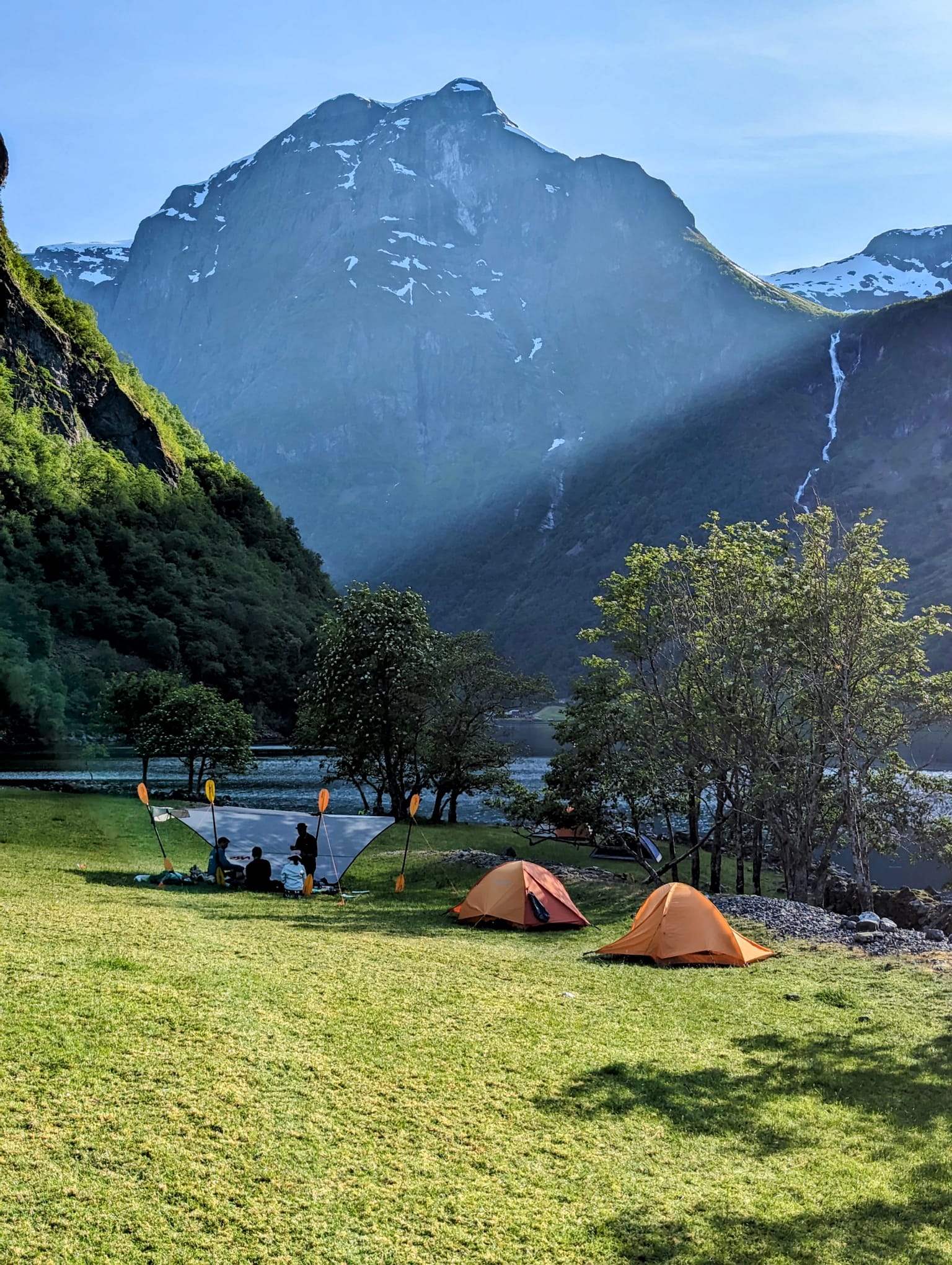 Stunning views of the Odnes camp and kayakers hanging out in nature