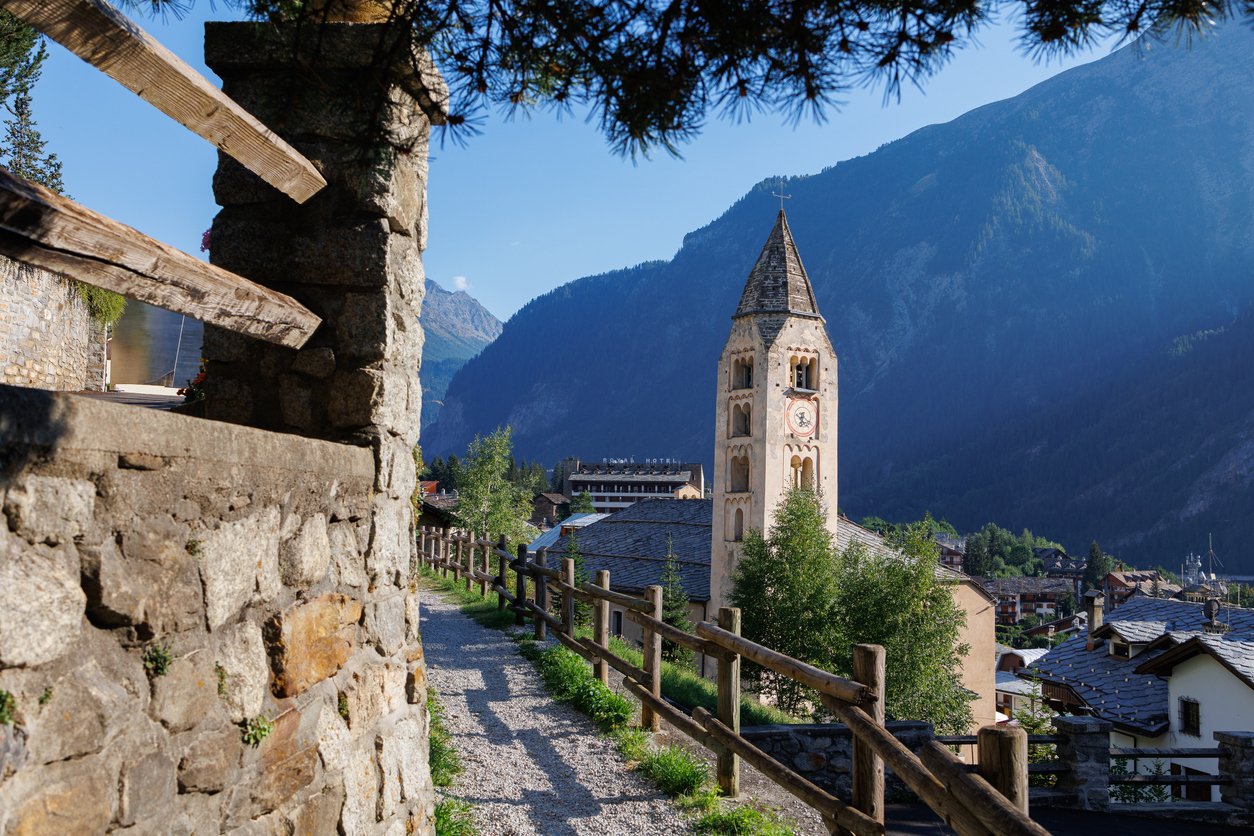 An Italian Alpine town of Courmayeur with a medieval church.
