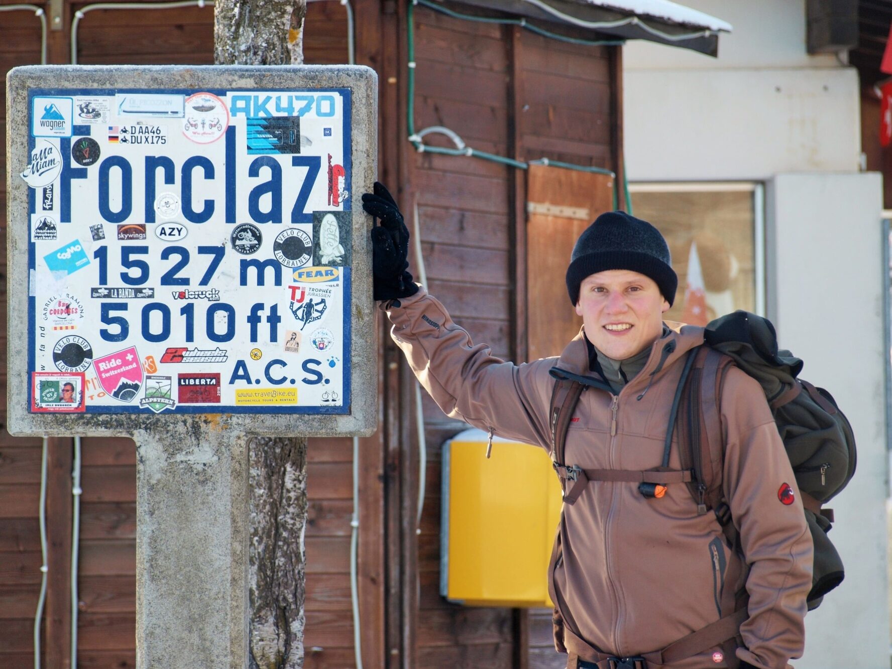 Forclaz sign and hiker