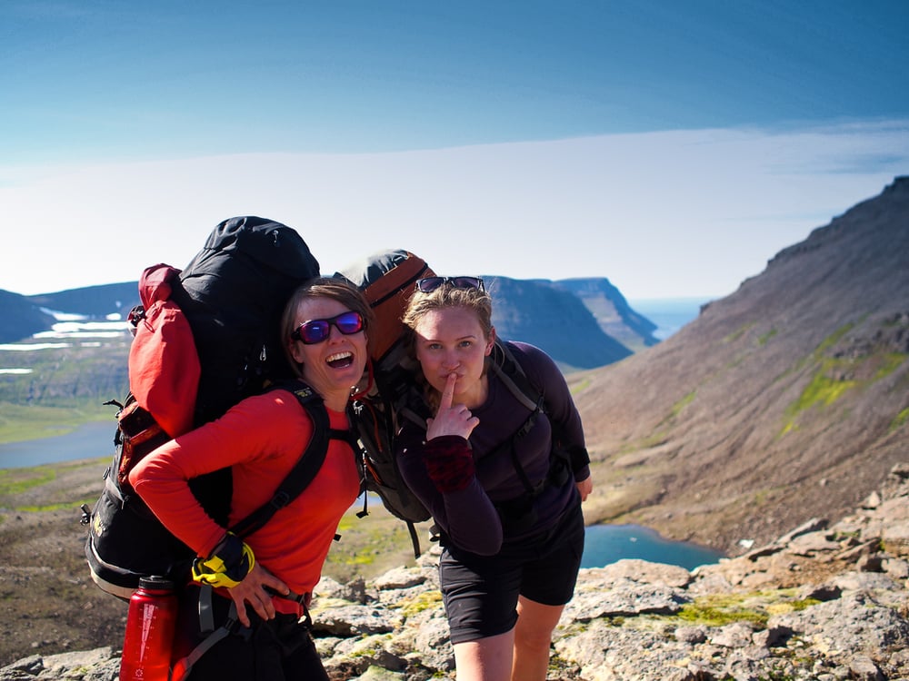 Happy hikers posing for a photo in Hornstrandir, Westfjords, Iceland.