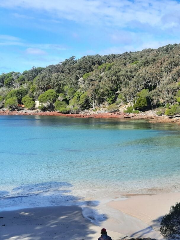 Hikers tackling the reggae shoreline in Beowa NP.