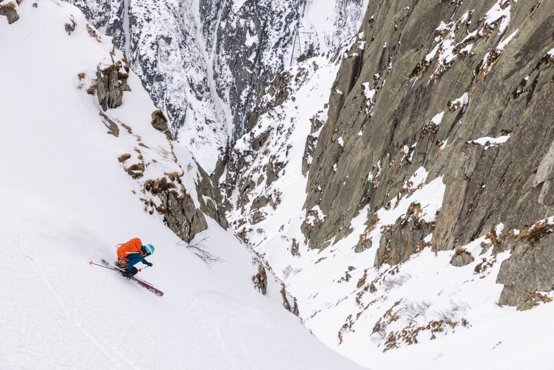 Steep slope and skier in the Swiss Alps