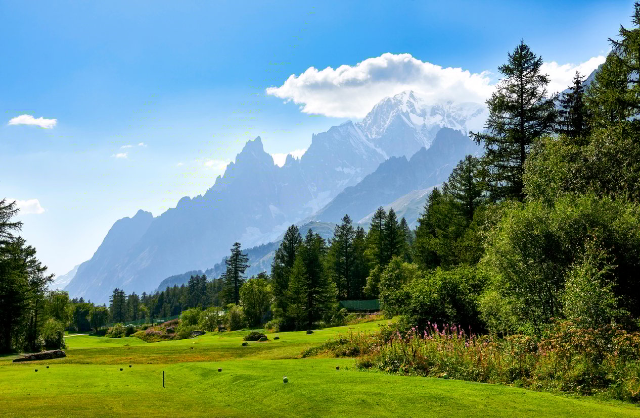 Bucolic Val Ferret Valley, encircled by mighty Alpine peaks, seen during the Tour du Mont Blanc Trek.