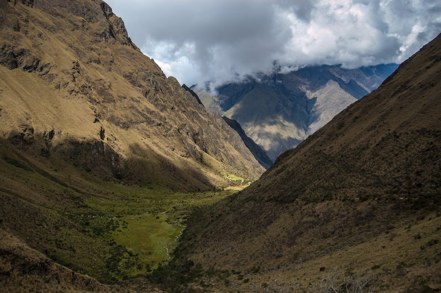 Andean valley surrounded by lofty mountains, seen during the Inca Trail to Machu Picchu.