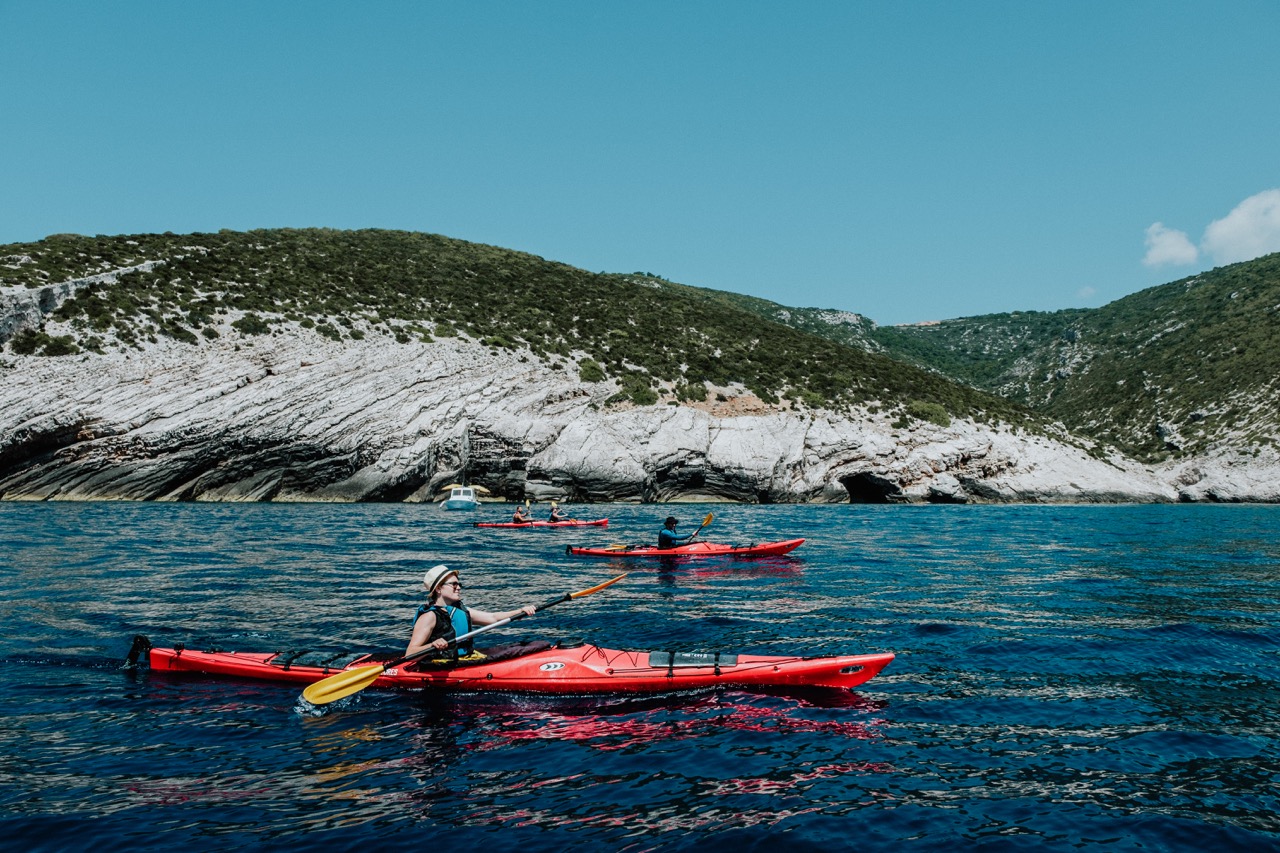 Cloud day and still sea are the perfect combination for kayaking