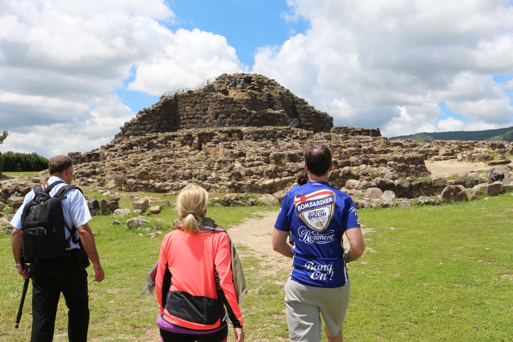 Cyclists touring ruins in Sardinia