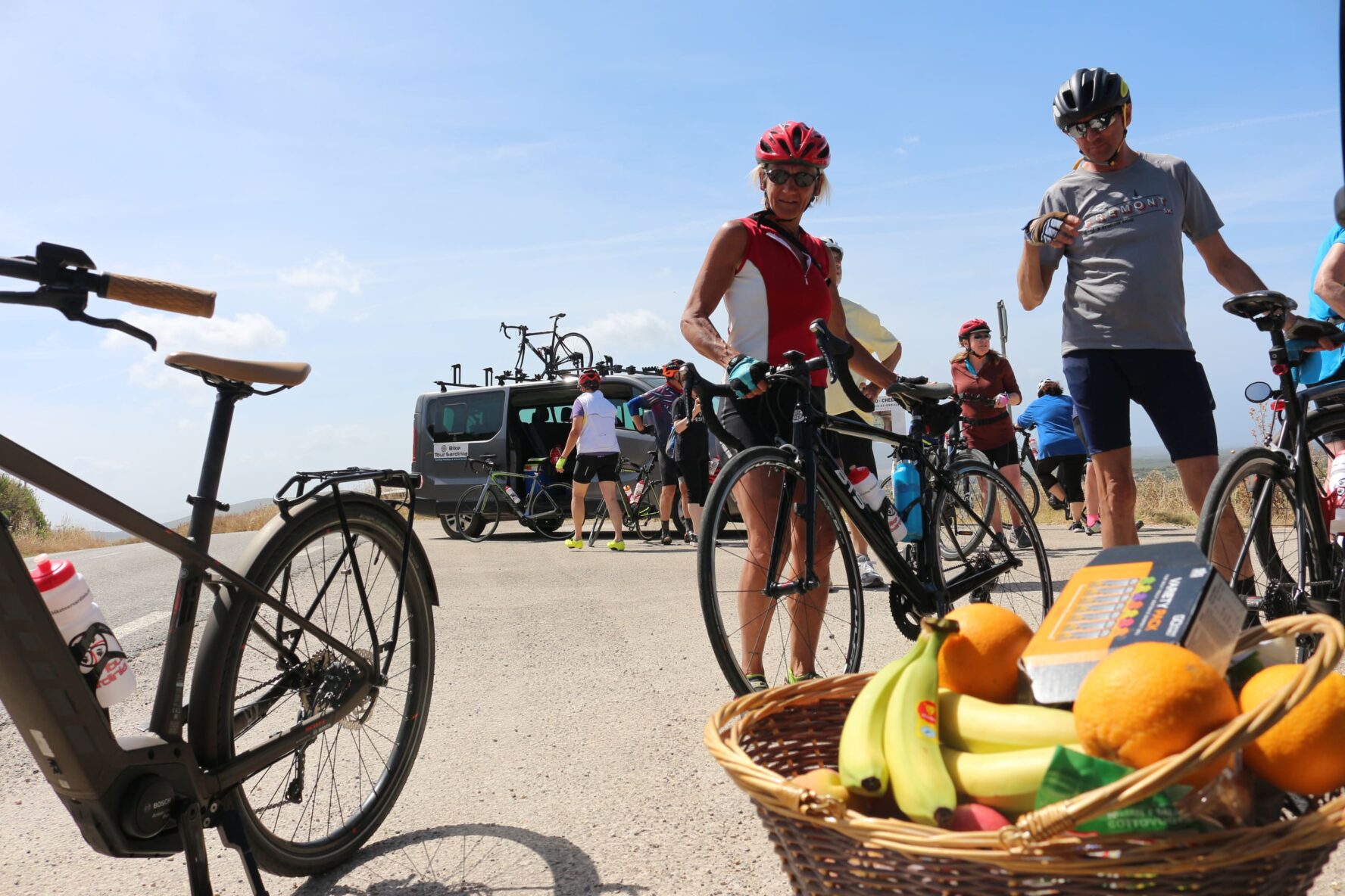 Fruit basket and cyclists in Sardinia