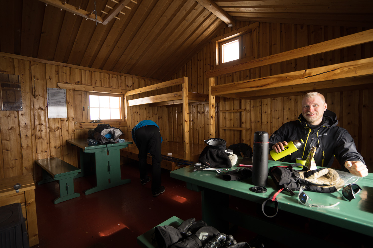 Skiers eating a meal in a hut in Halti, Finland