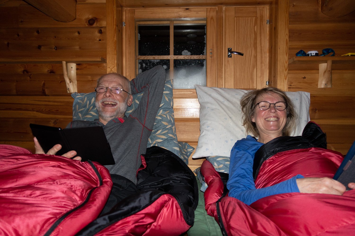 Two skiers tucked in for the night in a cabin in Halti, Finland.