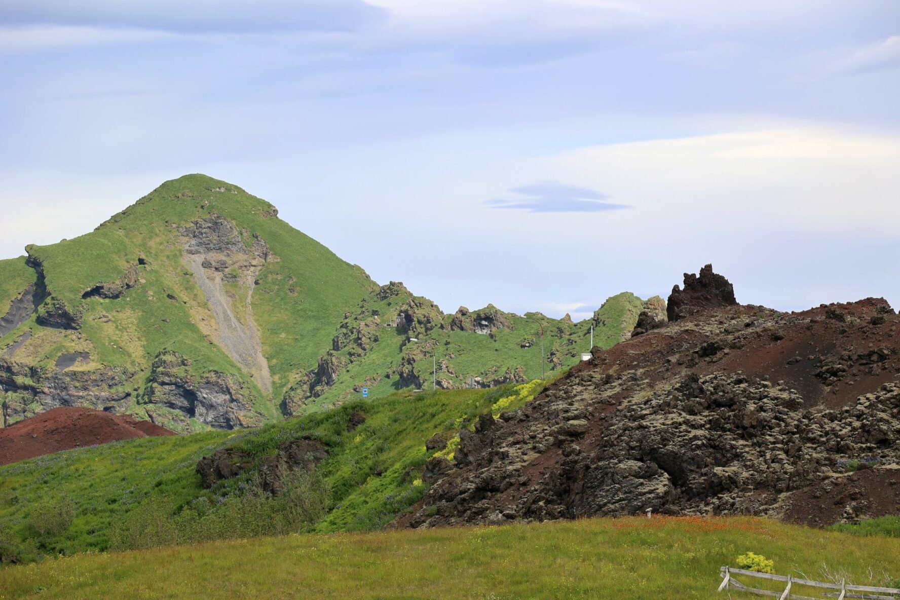 A green mountain on the Heimaey island in Iceland.