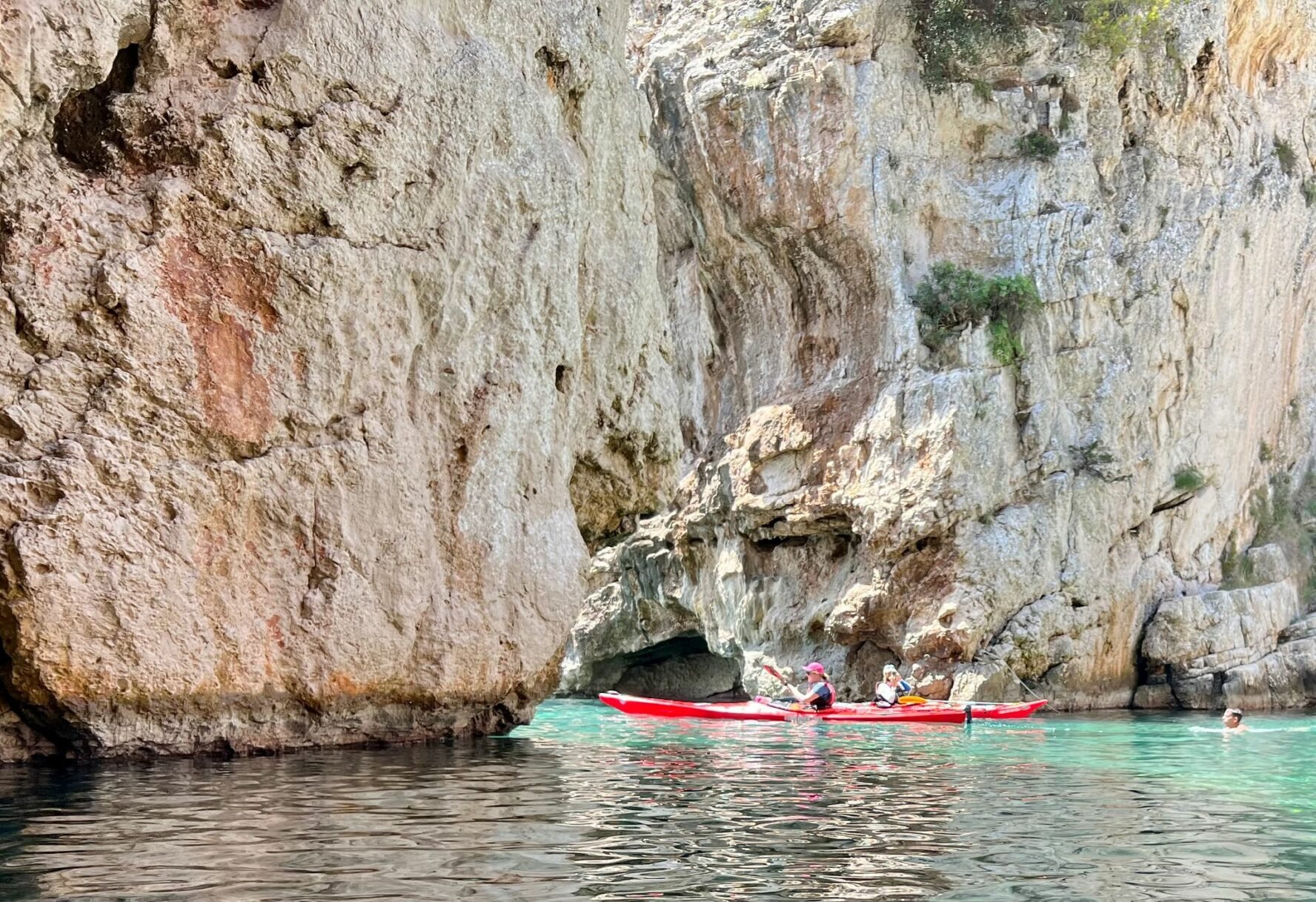 Kayaking under cliff arches