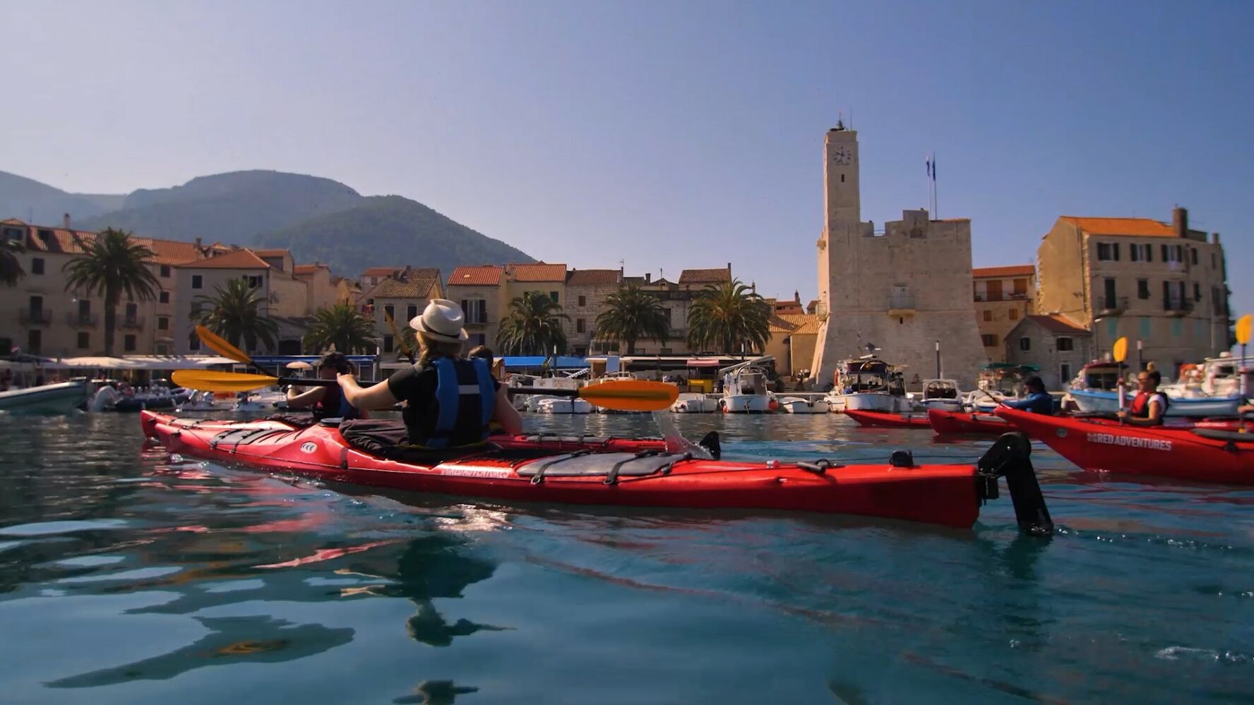 Kayakers arriving in Komiza Harbour