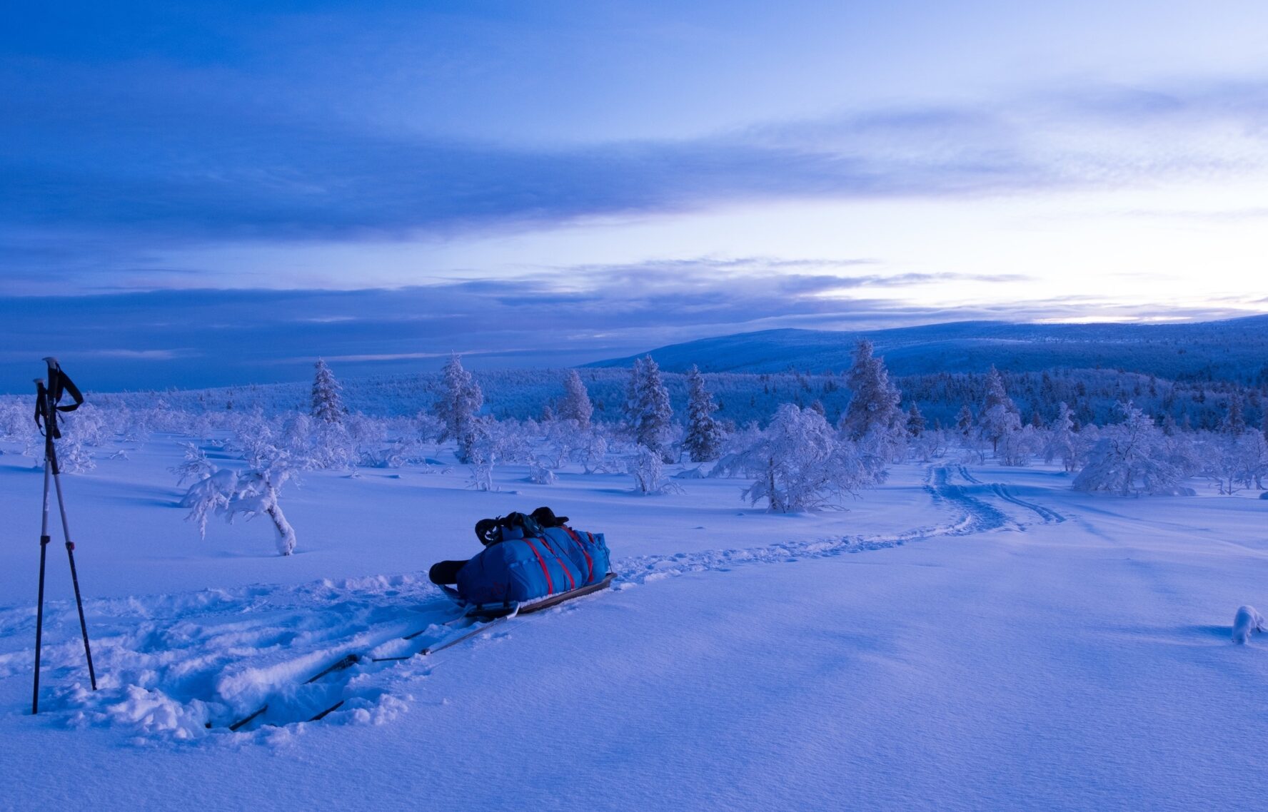 The winter landscape in Lemmenjoki, Finland, at sunset