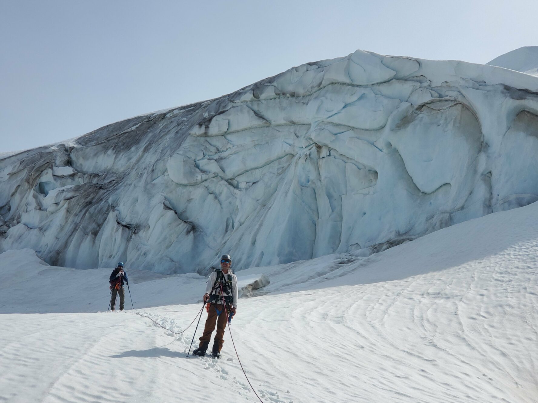 Mountaineers walking connected with a rope in Alaska