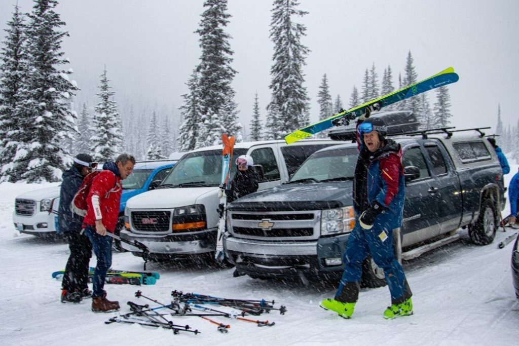 Off-piste skiers preparing to go skiing, British Columbia.