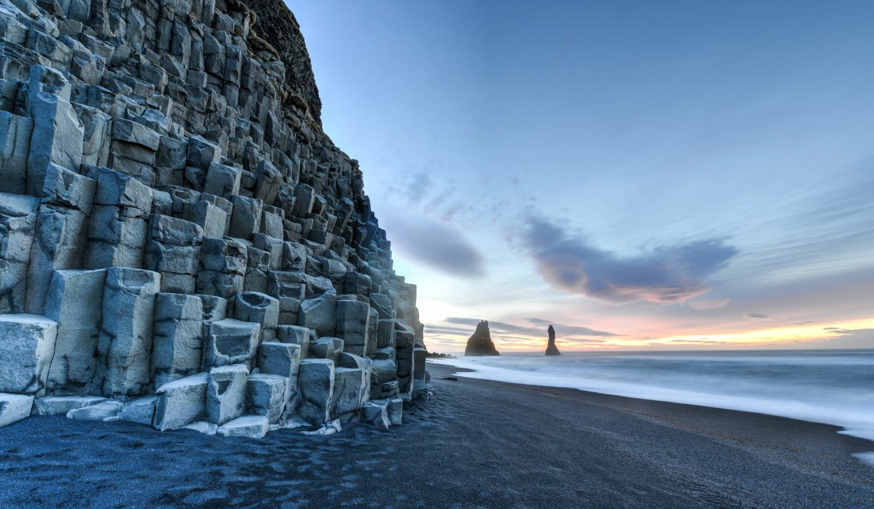 Black sand beach Reynisfjara in Iceland with recognizable basalt columns, South Coast, Iceland.