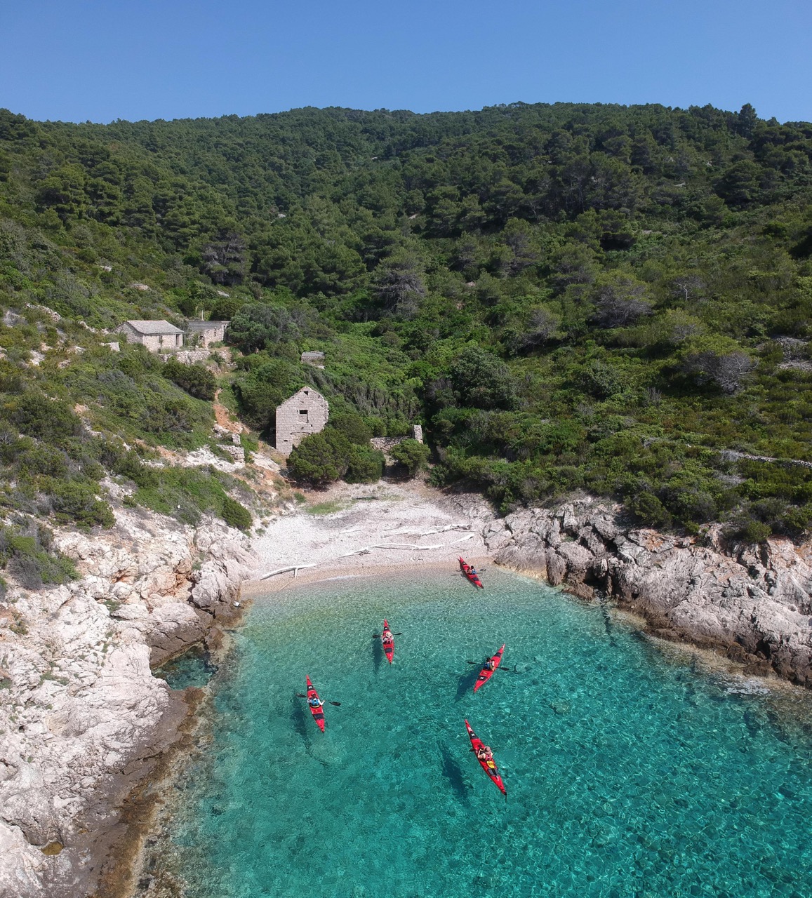 Kayakers taking a break in a secluded bay