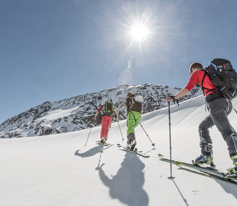 Backcountry skiers skinning in Silvretta, Austria.