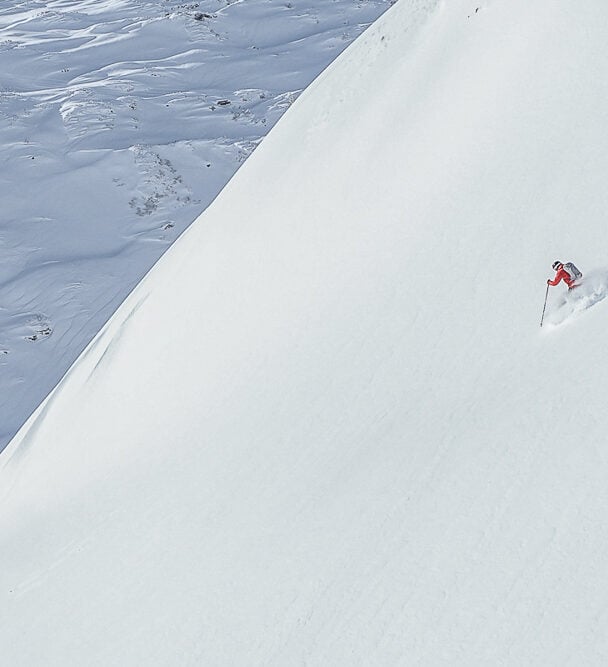 A skier posing on a slope near St. Anton, Austria