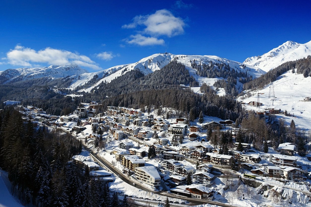 Ski resort St. Anton am Arlberg with mountainrange and blue skies in Austria.