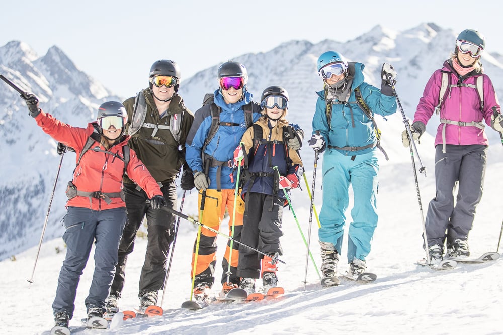 A family of skiers posing near St. Anton, Austria