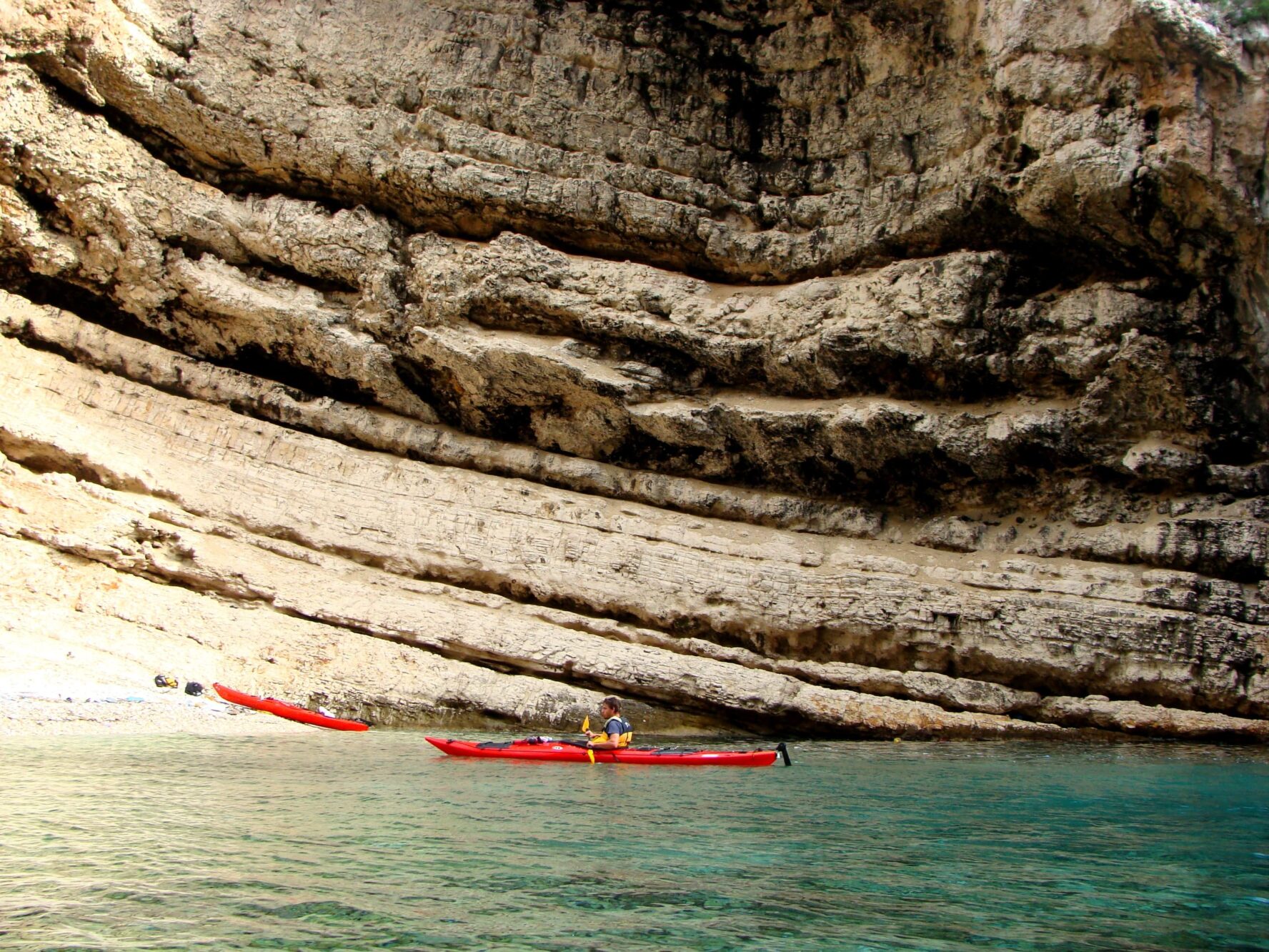 Kayaking by cliffs around Stiniva
