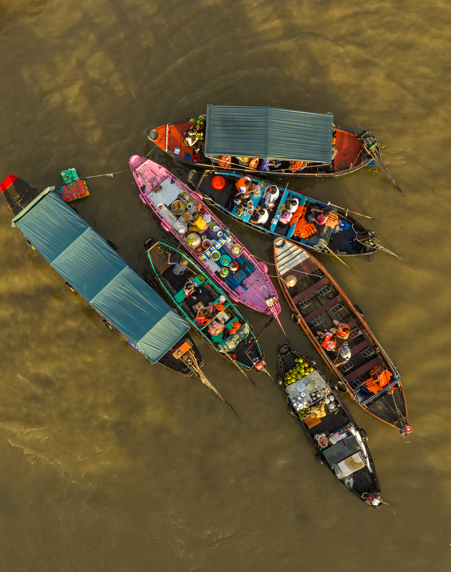 Abstract aerial image of boats moving busy at Cai Rang floating market, Can Tho city