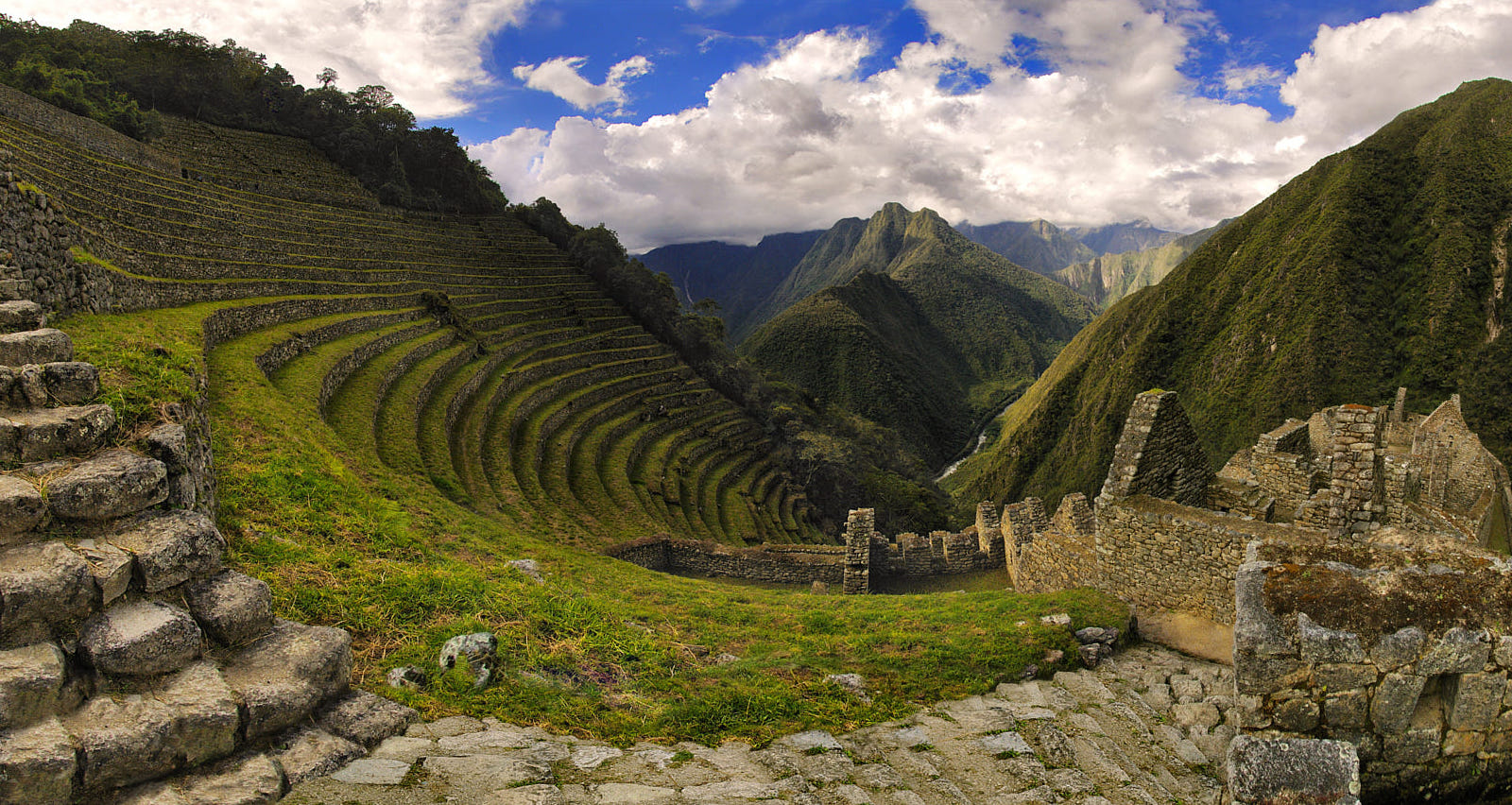 Terraced Incan archeological site Winay Wayna in Peru, with a magnificent Andean landscape surrounding it.