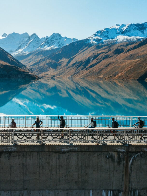 E-mountain bikers near Matterhorn, Swiss Alps.